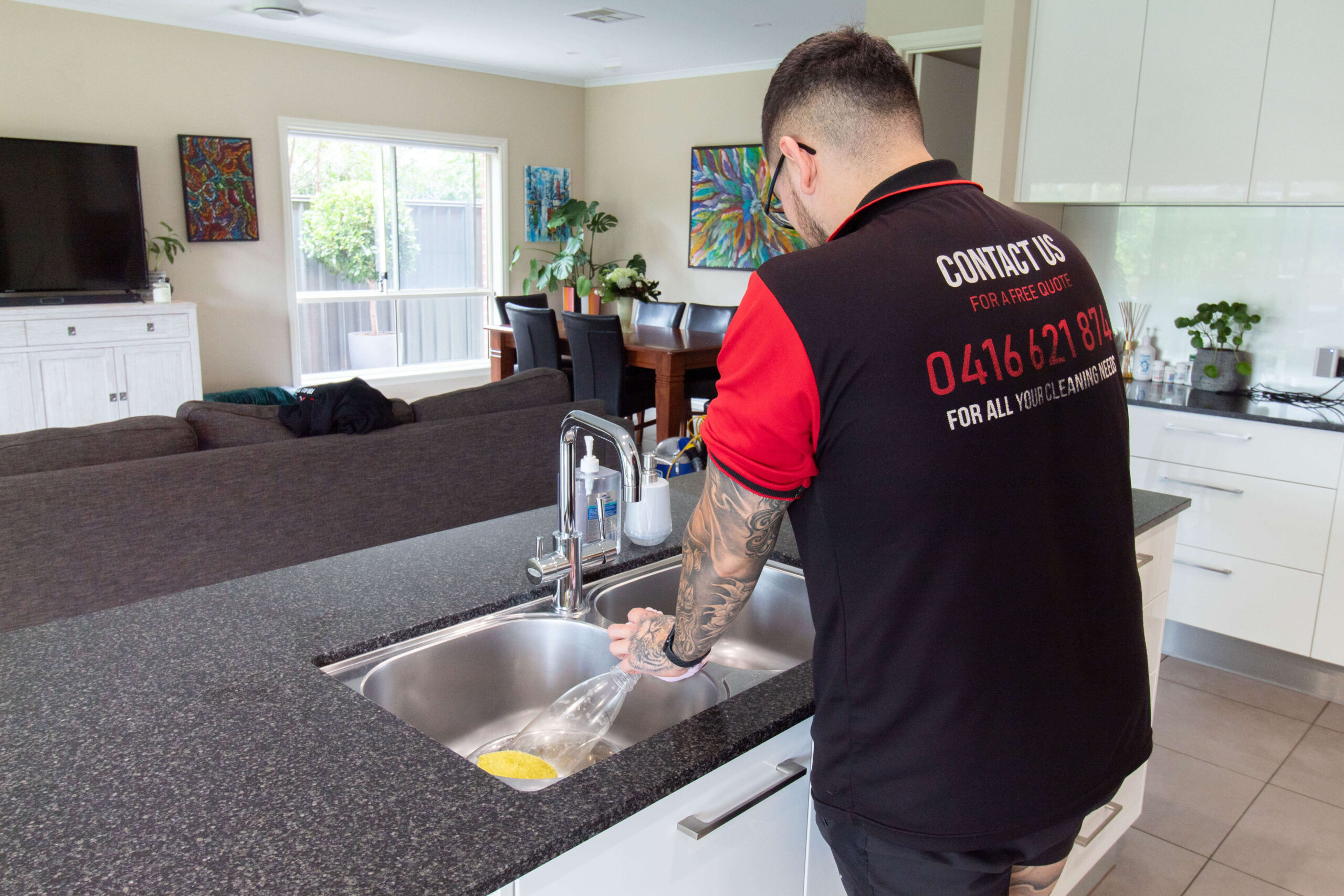 Advanced Home Services Staff Cleaning Kitchen Sink